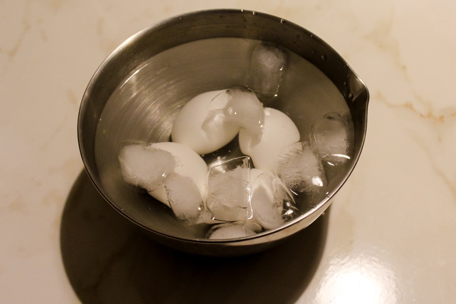 Cooling hard boiled eggs in ice water is the trick for creating perfectly peeled eggs. 